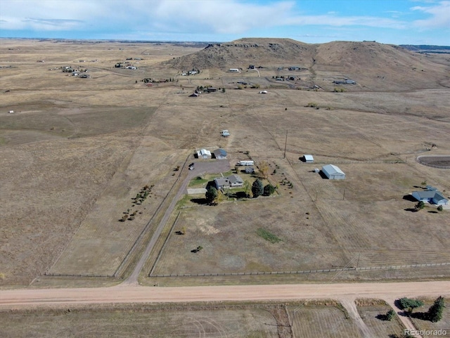 bird's eye view featuring a mountain view and a rural view