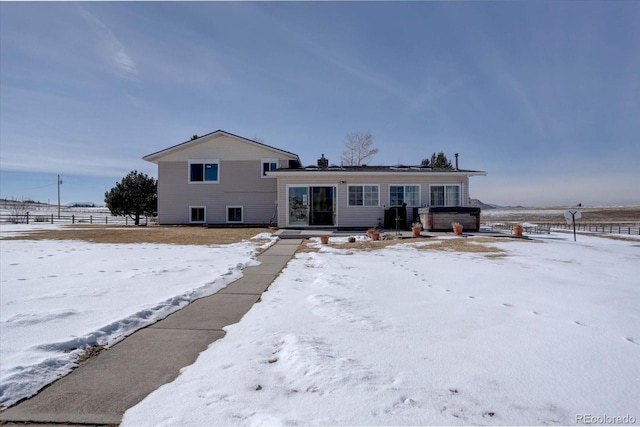 split level home featuring a hot tub