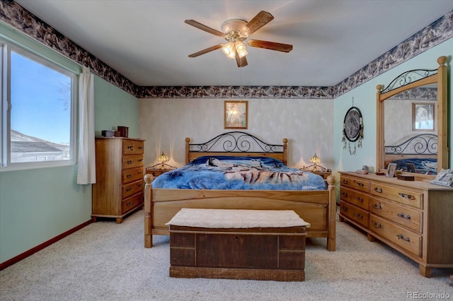 bedroom featuring ceiling fan and light colored carpet