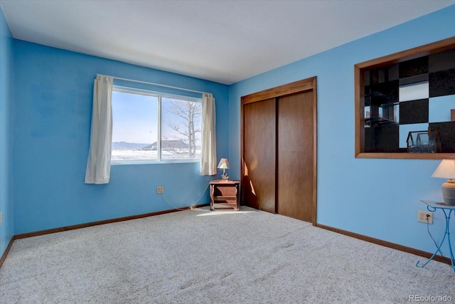 unfurnished bedroom with carpet and a closet