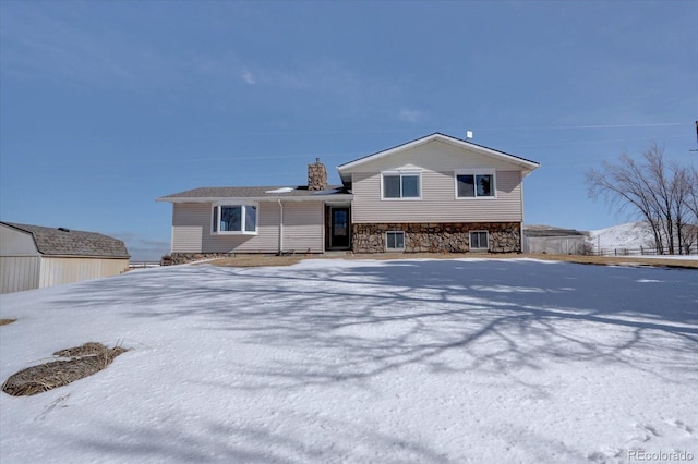 11810 Mesa View Rd, Larkspur, CO 80118 - view of front of home featuring stone siding and a chimney
