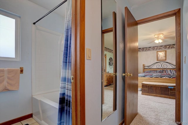 11810 Mesa View Rd, Larkspur, CO 80118 - ensuite bathroom featuring shower / bath combo, baseboards, and a ceiling fan