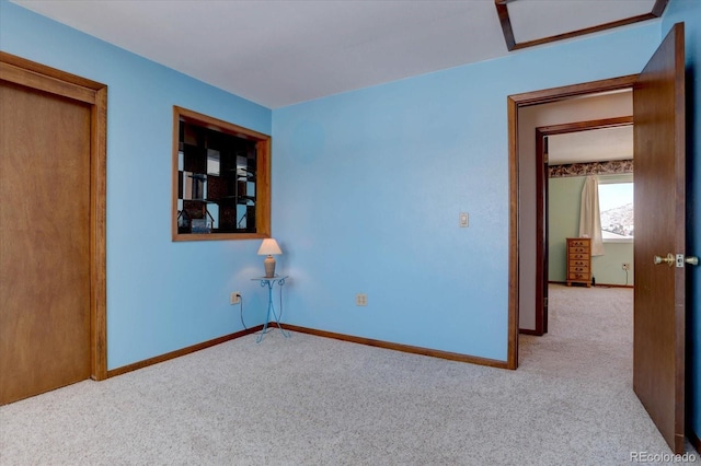 11810 Mesa View Rd, Larkspur, CO 80118 - unfurnished bedroom featuring carpet, attic access, and baseboards