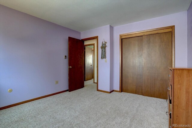 11810 Mesa View Rd, Larkspur, CO 80118 - unfurnished bedroom featuring carpet floors, baseboards, and a closet