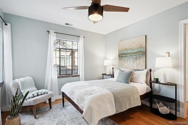 bedroom with hardwood / wood-style flooring and ceiling fan