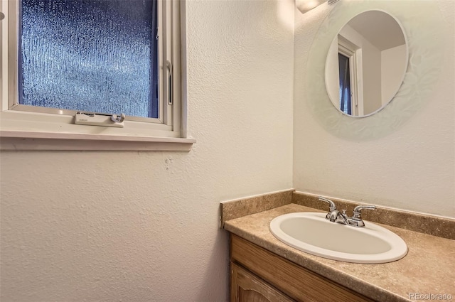 8759 E Roundtree Ave, Greenwood Village, CO 80111 - bathroom with vanity and a textured wall