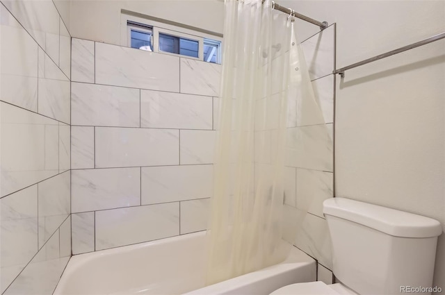 8759 E Roundtree Ave, Greenwood Village, CO 80111 - bathroom with toilet and shower / tub combo with curtain