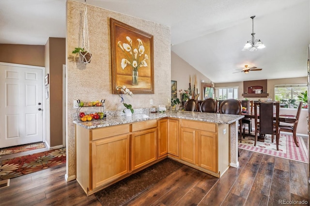 4759 Mt Princeton, Brighton, CO 80601 - kitchen featuring lofted ceiling, dark wood-style flooring, a chandelier, and a peninsula