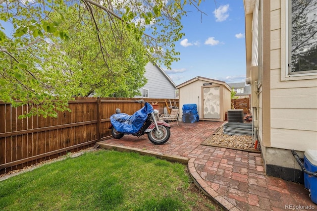 4759 Mt Princeton, Brighton, CO 80601 - view of yard with a shed, a patio area, an outbuilding, and central air condition unit