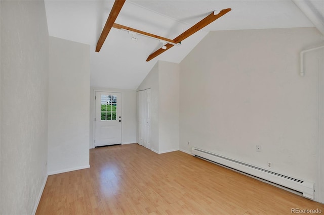 4480 S Pennsylvania St, Englewood, CO 80113 - empty room featuring a baseboard heating unit and light wood-style floors