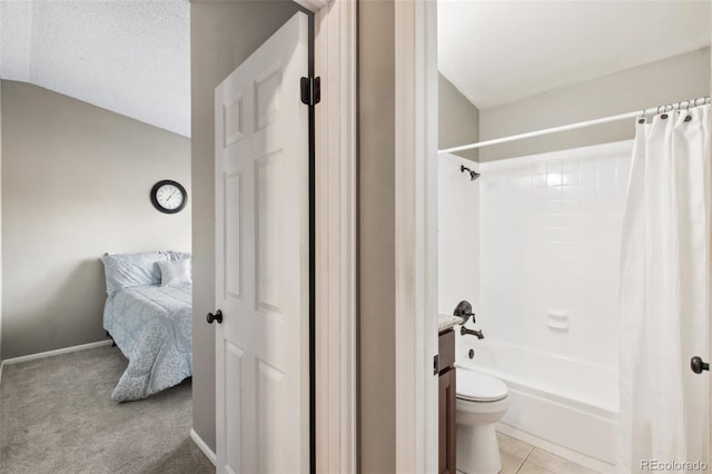 bathroom with vaulted ceiling, tile patterned flooring, toilet, a textured ceiling, and shower / tub combo