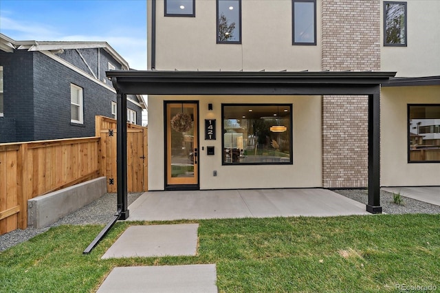 1423 Xavier St, Denver, CO 80204 - doorway to property with stucco siding and brick siding