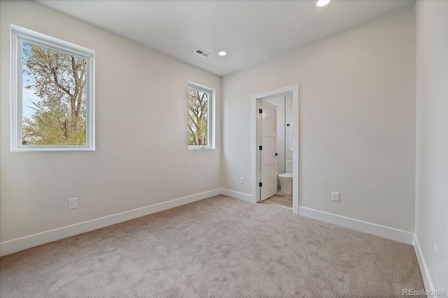 1423 Xavier St, Denver, CO 80204 - unfurnished bedroom with multiple windows, carpet floors, baseboards, and recessed lighting
