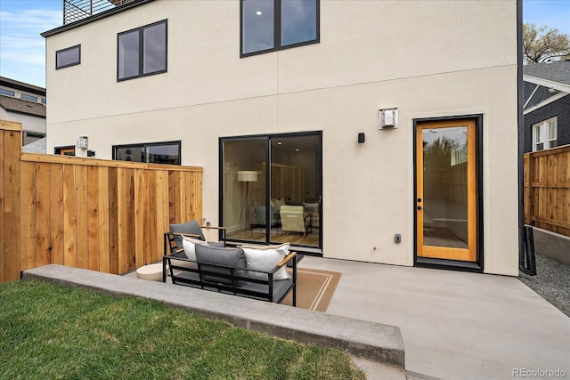 1423 Xavier St, Denver, CO 80204 - back of property with a patio area, an outdoor hangout area, and stucco siding