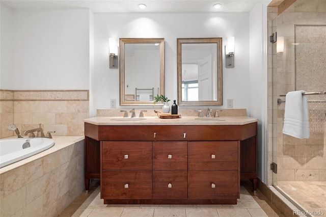 bathroom featuring tile patterned floors, vanity, and separate shower and tub