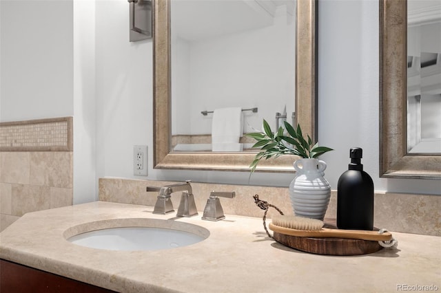 bathroom featuring vanity and ornamental molding