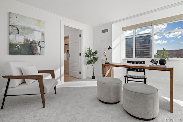 office area with visible vents, baseboards, crown molding, and carpet