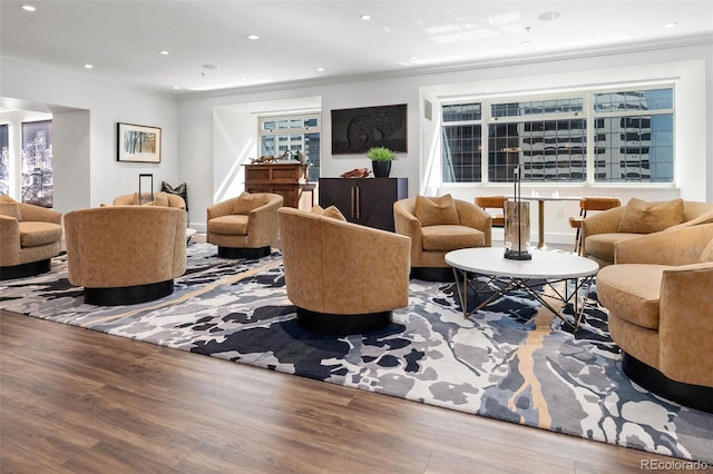 living room featuring crown molding and hardwood / wood-style floors