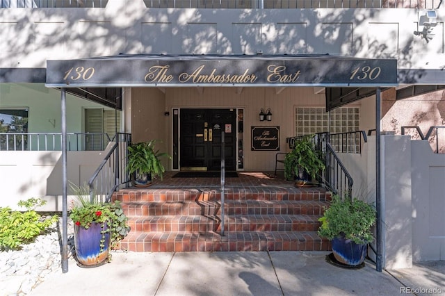 view of exterior entry featuring a porch