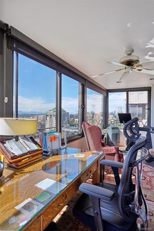 sunroom with a ceiling fan