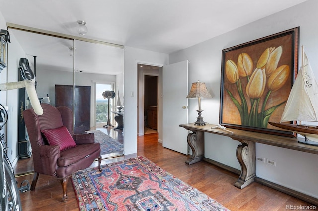 sitting room featuring wood finished floors