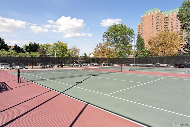 view of tennis court with fence