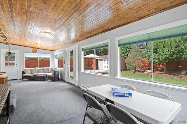 6504 W 85th Ave, Arvada, CO 80003 - sunroom with lofted ceiling, outdoor dining space, baseboard heating, and an outdoor living space
