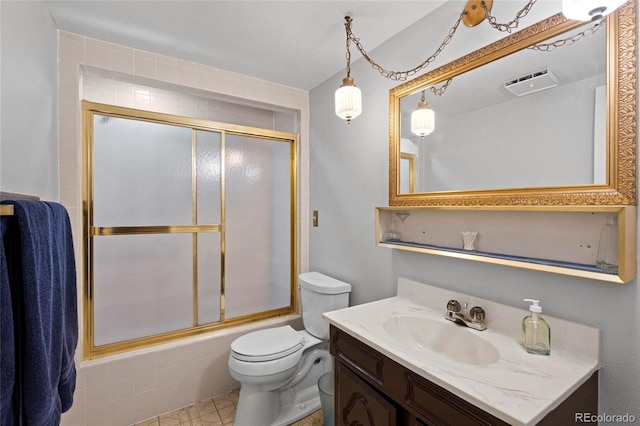 6504 W 85th Ave, Arvada, CO 80003 - bathroom featuring vanity and combined bath / shower with glass door