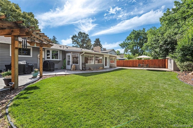 6504 W 85th Ave, Arvada, CO 80003 - back of house with a patio area, a pergola, a fenced backyard, and a chimney