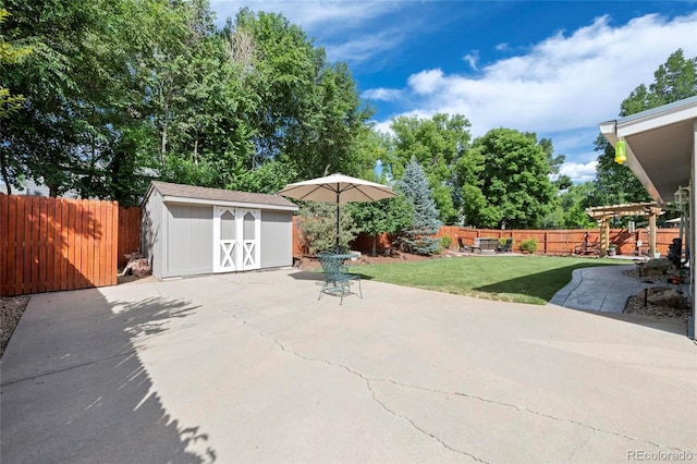 6504 W 85th Ave, Arvada, CO 80003 - fenced backyard with a patio area and a storage unit