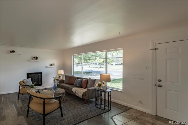 8800 W Kentucky Ave, Lakewood, CO 80226 - living room with wood finished floors, baseboards, and a glass covered fireplace