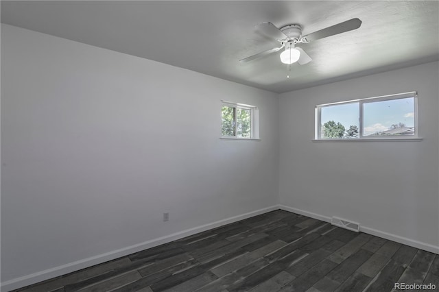 8800 W Kentucky Ave, Lakewood, CO 80226 - spare room with dark wood-style floors, baseboards, and ceiling fan