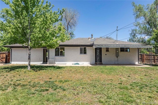 8800 W Kentucky Ave, Lakewood, CO 80226 - rear view of property featuring brick siding and a patio