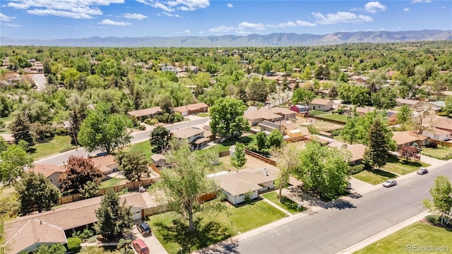 8800 W Kentucky Ave, Lakewood, CO 80226 - aerial perspective of suburban area featuring a mountainous background and a heavily wooded area