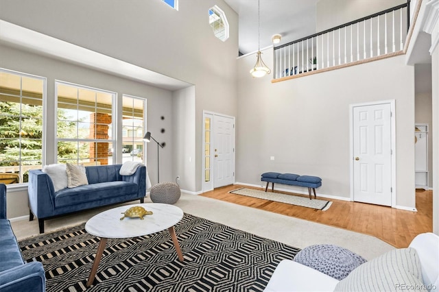 living area featuring wood finished floors and baseboards