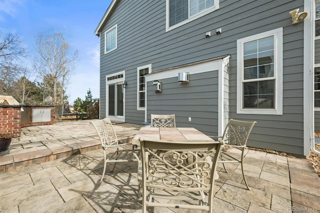 view of patio featuring outdoor dining area