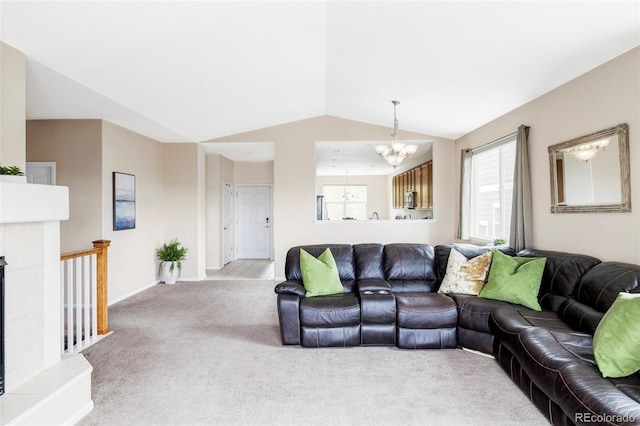 3972 S Shawnee Way, Aurora, CO 80018 - living area with light carpet, a chandelier, lofted ceiling, and baseboards