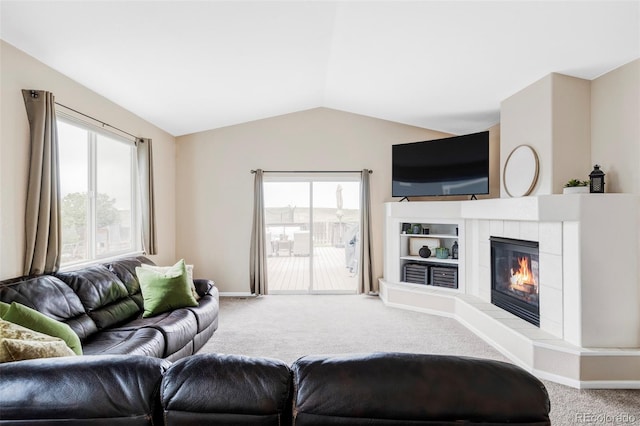 3972 S Shawnee Way, Aurora, CO 80018 - carpeted living area featuring lofted ceiling, healthy amount of natural light, a fireplace, and baseboards