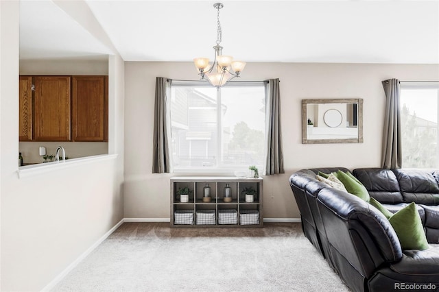 3972 S Shawnee Way, Aurora, CO 80018 - living area featuring a chandelier, carpet, and baseboards