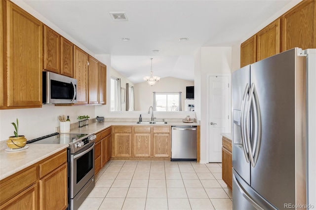 3972 S Shawnee Way, Aurora, CO 80018 - kitchen featuring stainless steel appliances, a sink, a chandelier, light countertops, and light tile patterned flooring