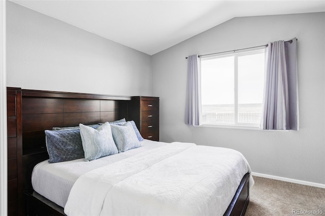 3972 S Shawnee Way, Aurora, CO 80018 - carpeted bedroom featuring vaulted ceiling and baseboards