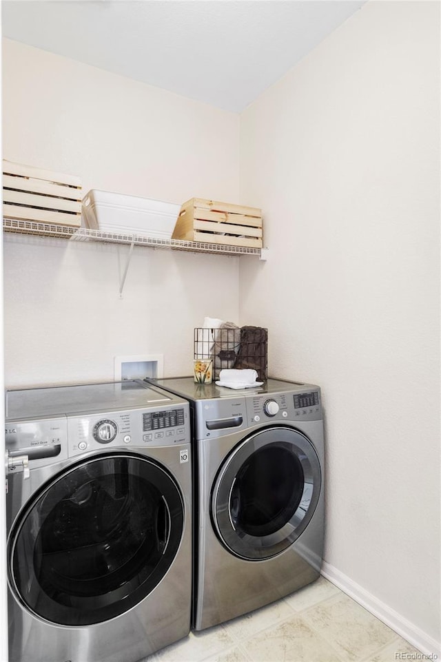 3972 S Shawnee Way, Aurora, CO 80018 - washroom featuring washer and dryer and baseboards