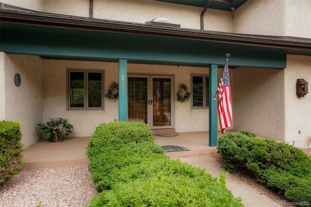 property entrance with covered porch