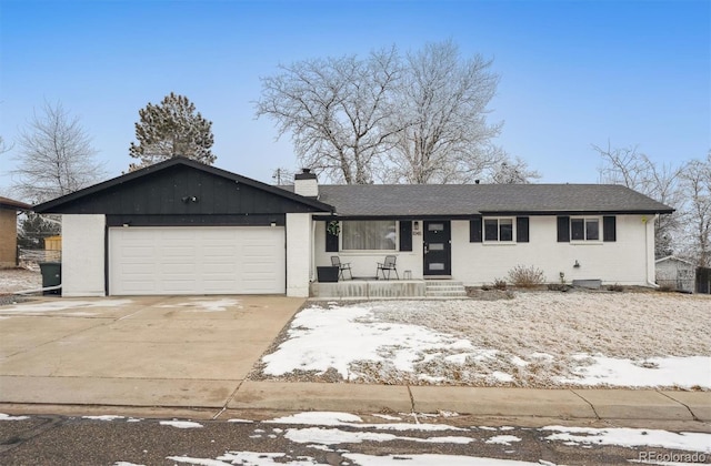 ranch-style house featuring a garage