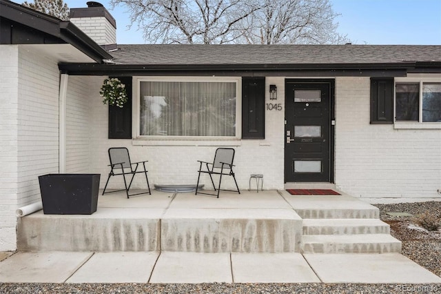 view of exterior entry featuring a porch