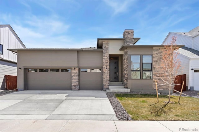 1711 Branching Canopy Dr, Windsor, CO 80550 - view of front of property with an attached garage, driveway, a chimney, and a front yard