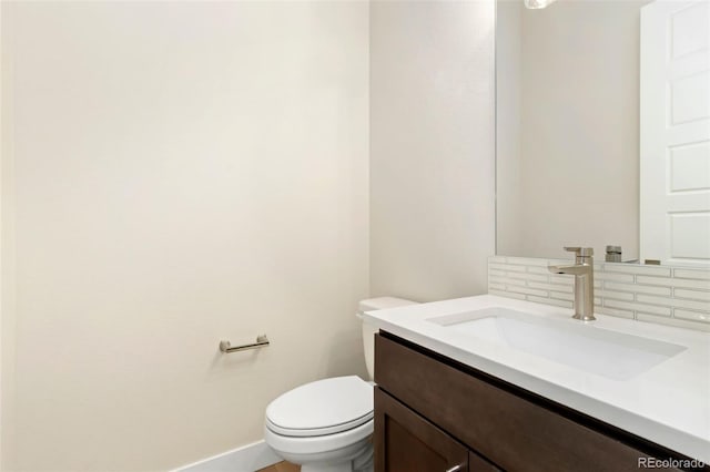 1711 Branching Canopy Dr, Windsor, CO 80550 - bathroom featuring tasteful backsplash, vanity, baseboards, and toilet