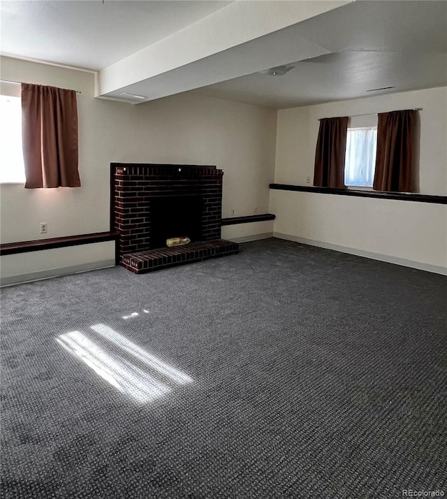 interior space featuring a brick fireplace and carpet floors