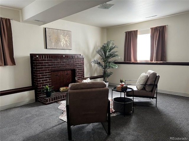 carpeted living room with a brick fireplace