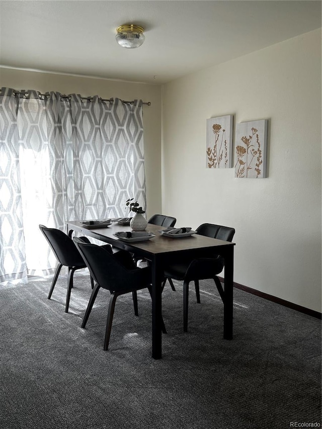 dining space featuring carpet